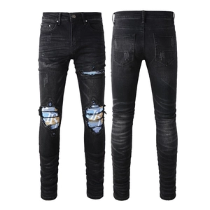 Men's slim fit black ripped jeans with stylish letter print knee patches and whiskers