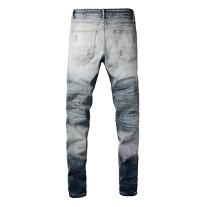 Detailed back view of vintage slim fit jeans featuring heavy wash and distressed fading