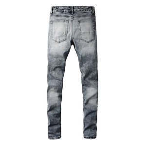 Close-up back view of men slim fit denim pants featuring vintage grey acid wash finish