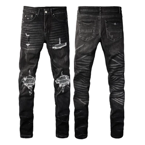 Men's high street slim fit black distressed jeans with plaid patches and whiskering effect