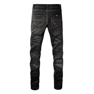 Rear view of slim fit jeans featuring tiger-patterned whiskering and back pocket details
