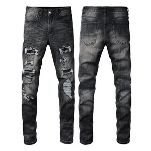 Jean denim slim fit pour homme en gris foncé délavé avec des patchs en strass