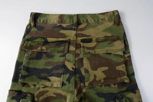 Detailed view of cargo camo pants showing rear flap pockets and durable cotton twill fabric