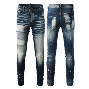 Jeans slim da uomo in blu lavato con schizzi di vernice bianca ed effetto vintage