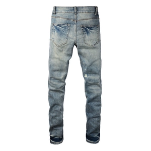 Slim fit light blue washed ripped denim jeans for men featuring classic back pockets and stretch