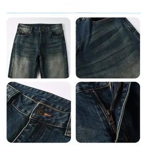 Detail view of deep blue denim jeans showing bronze button and smooth metal zipper fly