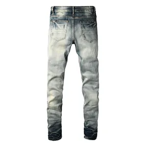 Detail of the back of American style distressed blue denim jeans with wash effects