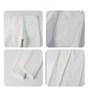 Detail view of premium white straight-leg trousers showing stitching and fabric texture