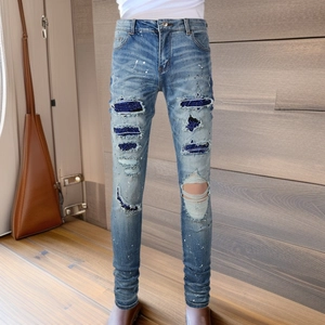 Men's slim fit light blue distressed jeans with paint splatters and sequin patch details