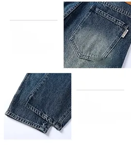 Detail view of denim jeans rear pocket and hem with premium washed texture and stitching