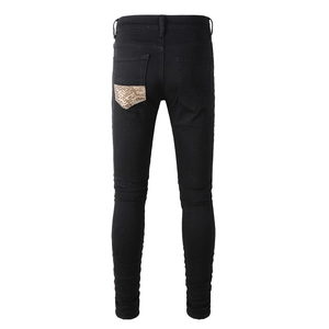 Men's slim fit black jeans featuring back leopard patch detail and high street styling