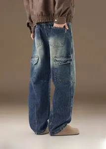 Detail view of vintage washed blue denim jeans with back pockets and classic stitching