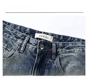 Detailed macro view of the vintage washed waistband on slim fit stretch denim jeans