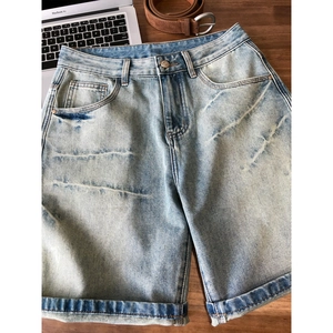 Classic light blue washed cotton denim shorts with high waist and cuffed hems for men