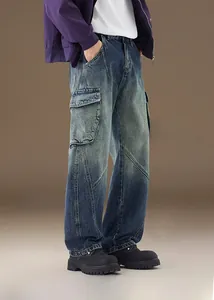 Detail view of washed blue vintage cargo jeans with large 3D side pockets and premium texture