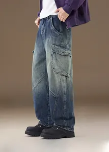 Detail view of cargo pocket and stitching on vintage washed blue denim jeans