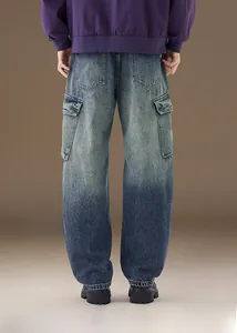 Macro view of vintage washed denim jeans featuring utility side flap pockets and cuffed hems