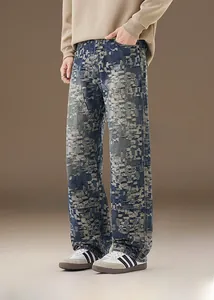 Detailed close-up of men's vintage washed jeans with unique geometric jacquard texture