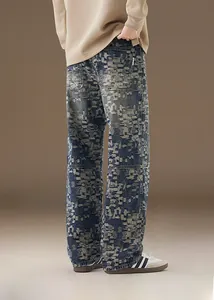 Macro shot of men's distressed denim jeans featuring unique pixelated digital camo texture