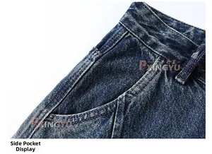 Detailed macro shot of blue washed denim waist, side pockets and metal rivet reinforcements