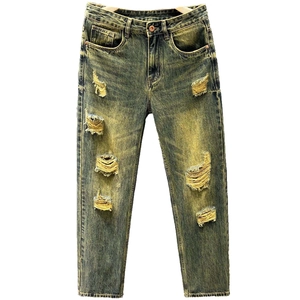 Slim fit ripped jeans for men featuring retro yellow wash and distressed denim details