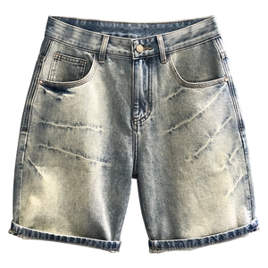 Men's light blue washed denim shorts with vintage distressed whiskers and cuffed hem