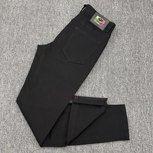 Slim fit black denim jeans for men with vintage wash and premium leather brand patch