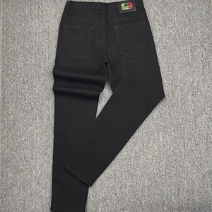 Slim fit black denim pants for men with vintage wash and premium branded leather patch