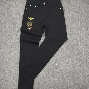 Slim fit black distressed jeans with gold eagle embroidery and vintage wash details
