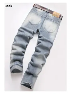 Back view of light blue distressed jeans with leather belt and brand patch detail