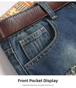 Detailed close-up of dark blue denim jeans front pocket with rivets and contrast stitching