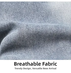 Macro shot of breathable light blue denim fabric with natural washed texture and twill weave