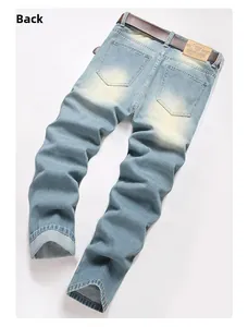 Rear view of light blue straight-leg jeans with vintage washed finish and leather belt