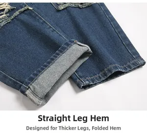 Detailed macro view of distressed hem and cuffed edges on dark blue straight jeans
