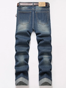 Men's vintage dark blue straight distressed denim jeans with back leather patch detail