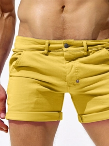 Slim fit men's casual cotton twill shorts in vibrant yellow with rolled cuffs and side pockets