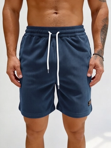 Men's navy blue corduroy casual shorts with elastic drawstring waist and side logo