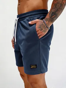 Men's dark blue corduroy casual shorts with white drawstring and side patch detail