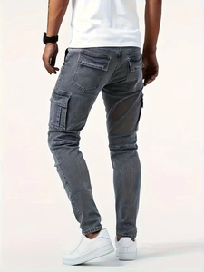 Close-up of gray washed slim-fit cargo jeans showing functional side flap pockets and texture
