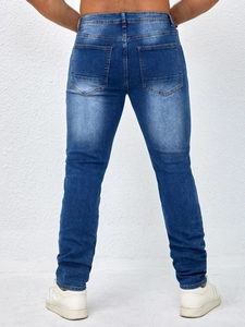 Men's slim-fit mid-blue distressed denim jeans with washed effect and rear pockets