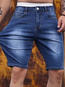 Men's slim stretch denim shorts in dark blue with washed finish and knee-length fit