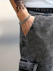 Classic silver cuban link chain bracelet for men with a polished bold metal finish