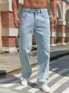 Men's loose light blue straight jeans with high waist and adjustable fit shown outdoors