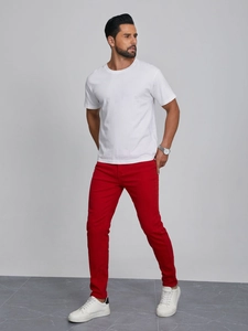 Men's slim fit casual red trousers with white t-shirt and sneakers professional outfit