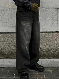 Men's loose wide-leg dark grey jeans with a vintage washed finish and relaxed urban fit