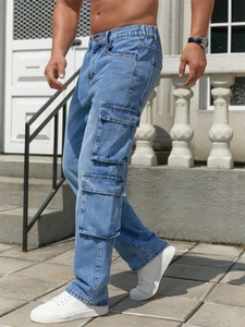 Men's loose fit cargo jeans in light blue wash featuring side pockets and elastic waist