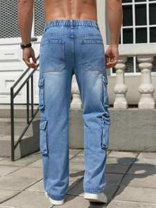 Men's light blue cargo jeans with elastic waist and large side pockets in washed denim