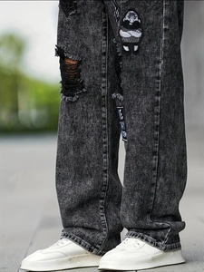 Men's fashion snowflake wash ripped jeans with cartoon patches and loose fit cut