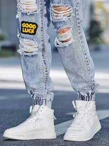 Slim fit light blue distressed jeans for men with embroidery patch and streetwear style