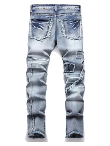 Slim fit light blue distressed jeans with biker patches and shredded fringe details